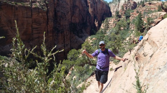 Steve on a cliff with some handy chains.